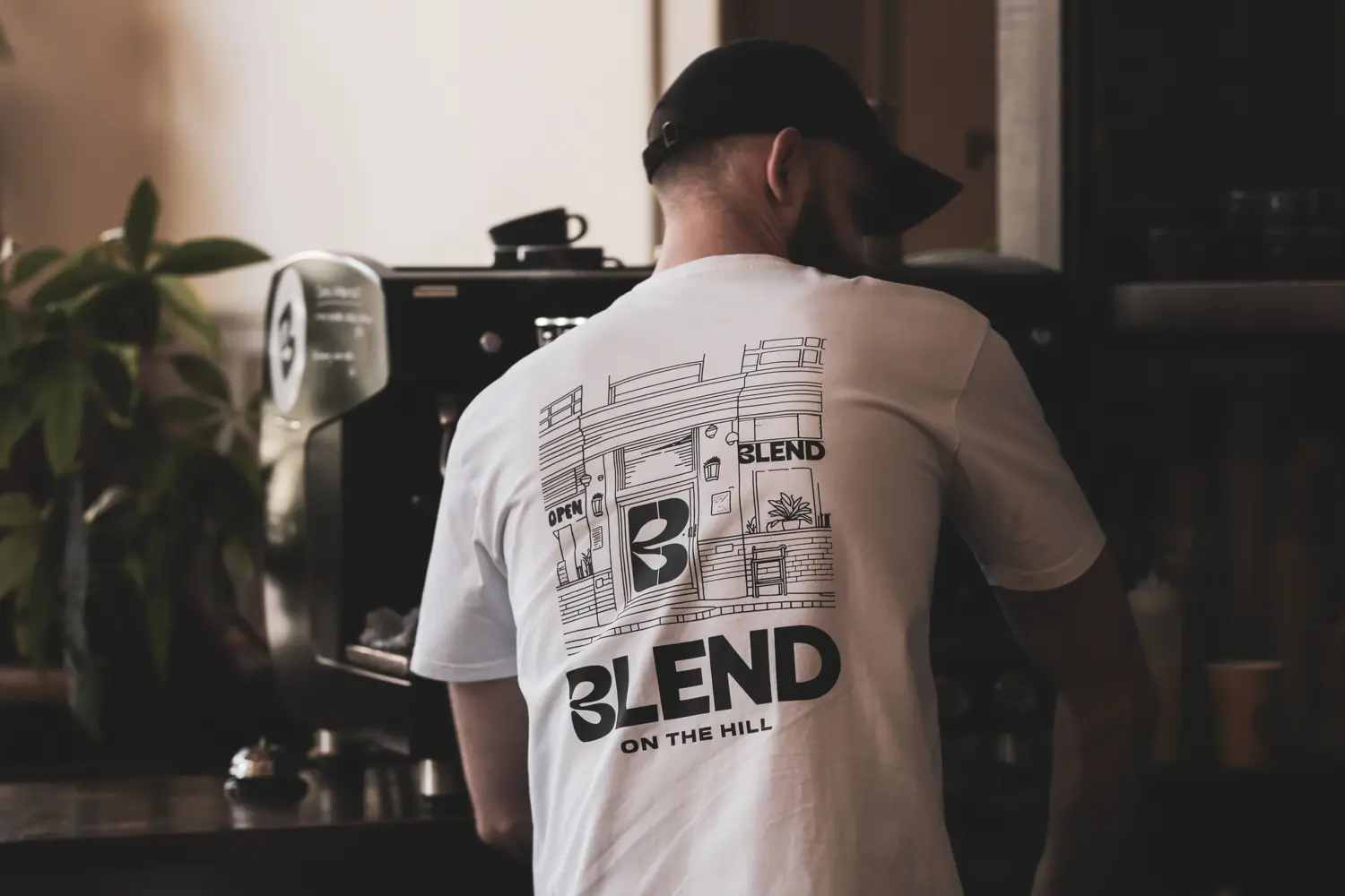 Back of the Blend On The Hill tee showing the storefront illustration