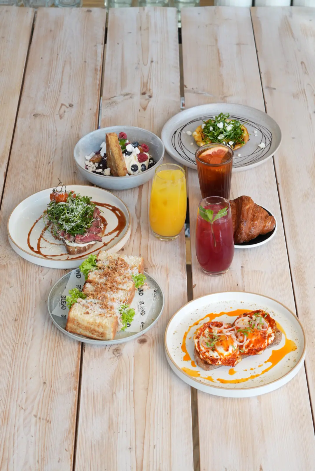 Overhead brunch spread with drinks