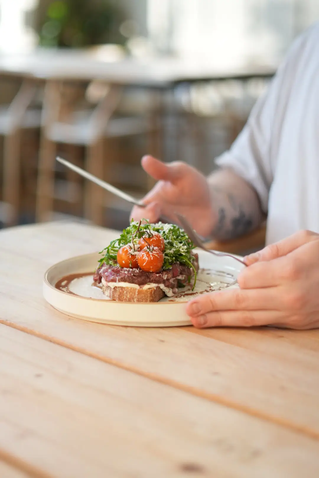 Steak with blistered tomatoes on the vine